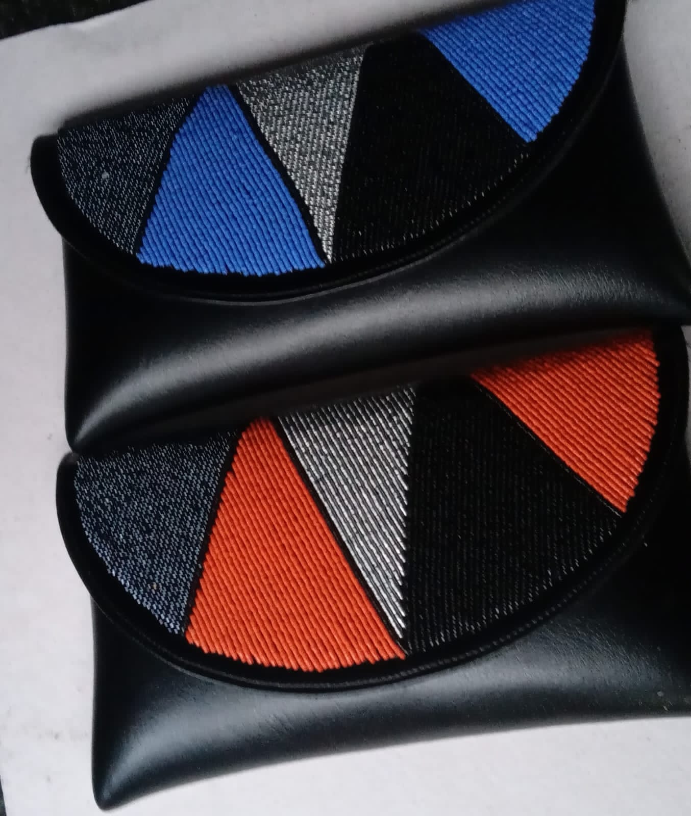 Beaded leather clutch bags